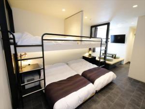 Postel nebo postele na pokoji v ubytování CHA-AN HOTEL UENO