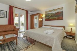 Postel nebo postele na pokoji v ubytování Eva in Poreč * Istrien