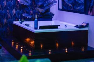 a bathroom with a bath tub with lights in it at Sierra loft vip in Prado del Rey