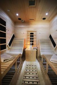 a sauna with wooden bunk beds and a table at Magnetfels in Lenzkirch