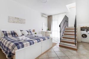Łóżko lub łóżka w pokoju w obiekcie Portobello Apartments