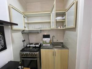 A kitchen or kitchenette at Private Cozy Furnished Studio no 14 Khalidiya Park Villa Abu Dhabi UAE