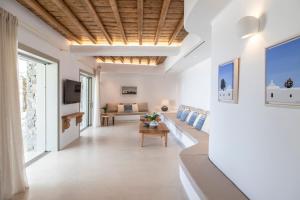 A television and/or entertainment centre at Ker Estate by Ethos Hospitality