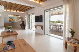 A television and/or entertainment centre at Ker Estate by Ethos Hospitality