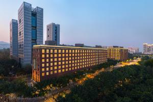 an office building in a city with tall buildings at Somerset Chayuan Chongqing in Chongqing
