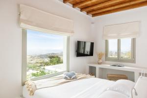 A bed or beds in a room at Ker Estate by Ethos Hospitality Még 37 kép