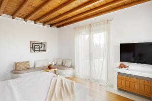 A television and/or entertainment centre at Ker Estate by Ethos Hospitality