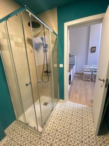 a glass shower stall in a room with a hallway at Studio in Barrio Salamanca (D) in Madrid +16 photos