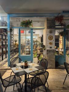 a table and chairs in front of a restaurant at MARTIN Nicosia City Suites in Nicosia