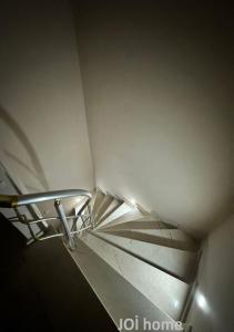 a stairwell in a building with a metal railing at joi home in Istanbul