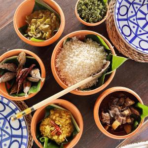 a group of bowls filled with food on a table at Three Creeks Matale in Matale