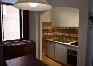 a kitchen with a sink and a counter top at STELLA HOUSE in Porto Santo Stefano