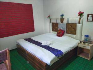 Letto o letti in una camera di Hotel New Heaven Canal