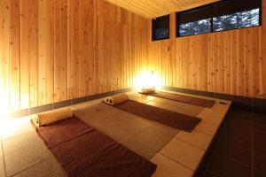 Postel nebo postele na pokoji v ubytování Karuizawa Hotel Longing House