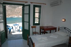 Postel nebo postele na pokoji v ubytování Τζαννής Αγλαΐα
