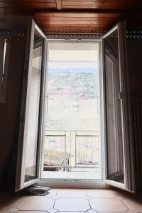 an open window in a room with a view at City Garni in Martigny-Ville