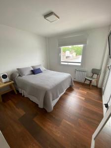 En eller flere senge i et værelse på Departamento vieytes