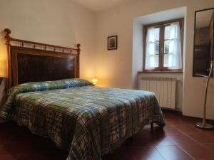 A bed or beds in a room at Agriturismo Podere Fiume