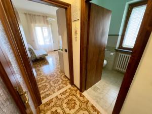 Postel nebo postele na pokoji v ubytování L'OLIVO DI EVELINA