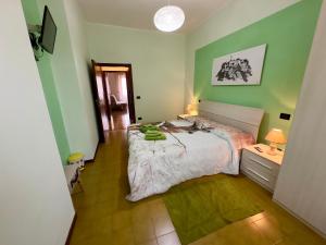 Postel nebo postele na pokoji v ubytování L'OLIVO DI EVELINA
