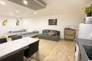 a large living room with a couch at Work&Stay Apartments Hellenthal in Hellenthal