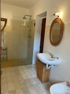 a bathroom with a sink and a shower at Corgos, Lagarto in Monchique