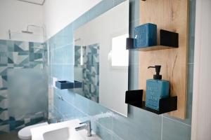 a bathroom with a sink and a mirror at Mary Lucy in Porto Cesareo +45 photos