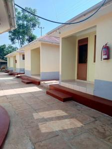 a row of houses are lined up next to each other at Agabet Hotel - Mbale in Mbale