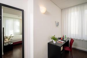 Ένα ή περισσότερα κρεβάτια σε δωμάτιο στο Hotel Rio Muralto