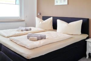 a bed with two pillows on top of it at Fewo Dobra in Lübbenau