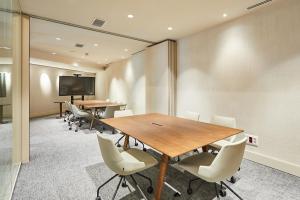 a conference room with tables and chairs and a screen at Silken Platja d'Aro in Platja d'Aro +58 photos