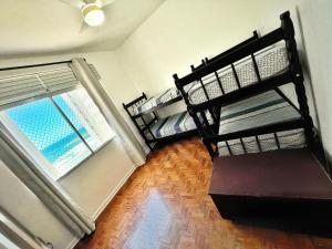 Кровать или кровати в номере Apartamento 4 quartos, 3 banheiros, vista para o mar Pitangueiras, sacada, 1 vaga de garagem, apenas 50 metros do mar +23 фотографии