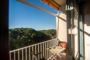 a balcony with a table and chairs and a view at Monolocale CM in Follonica