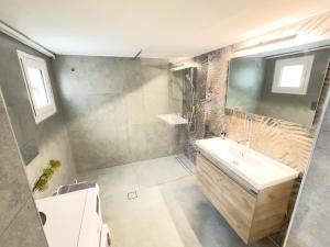 a bathroom with a sink and a shower at Cozy Home with Yard & Cottage Charm in Athens in Athens