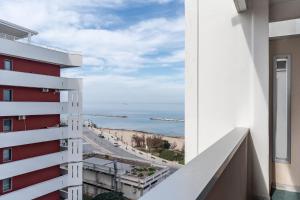 a view of the ocean from a building at Pane&Pomodoro Apartment in Bari