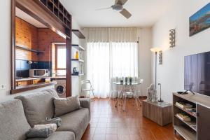 a living room with a couch and a table at Pane&Pomodoro Apartment in Bari