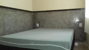 Cama o camas de una habitación en Casa em Capitólio
