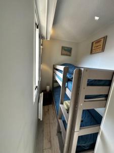 a small room with two bunk beds in it at Appartement centre Arcachon in Arcachon