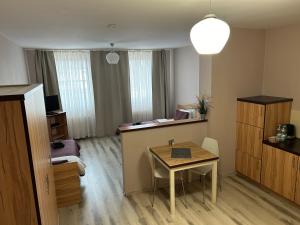 Posedenie v ubytovaní H-T-L Apartamenty Junior