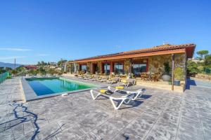 a villa with a swimming pool and a house at Villa Silence Lux with Pool in Nature and Aircon in Maçanet de la Selva