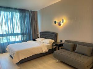Кровать или кровати в номере Sea Breeze Apartments