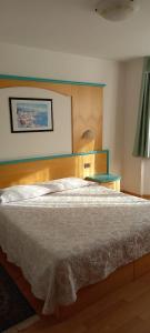Postel nebo postele na pokoji v ubytování Hotel Giusy + 4 fotografie