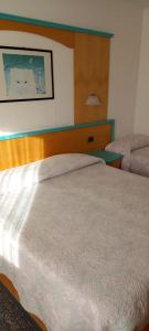 Llit o llits en una habitació de Hotel Giusy