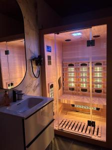 a large bathroom with a shower and a sink at Green Resort Bran in Bran