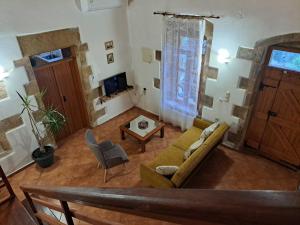 a living room with a couch and a table at Villa Nama in Kissamos