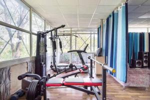 a gym with two exercise bikes in a room at 3BR Apartment by B-Town stays in Dehradun