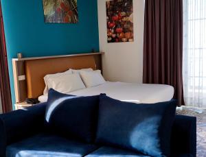 Letto o letti in una camera di Hotel Monaco & Garden