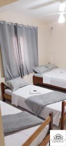 Кровать или кровати в номере Pousada Parada Da Fé