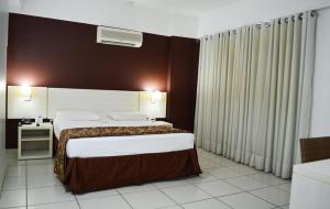 Cama ou camas em um quarto em Apartamento Le Jardin
