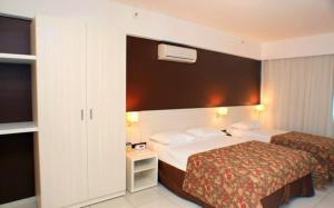 Cama ou camas em um quarto em Apartamento Le Jardin